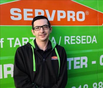 photo of male SERVPRO employee Robert Taranto in front of green background