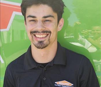 Male Technician Outside Servpro Vehicle