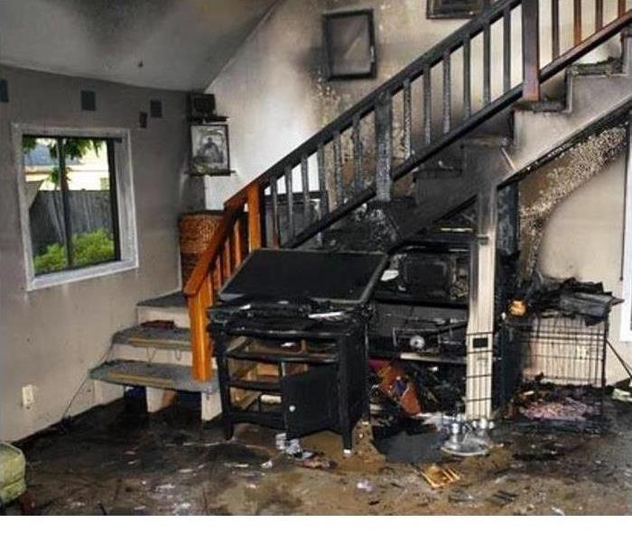 Fire smoke and soot damage to a staircase and living area